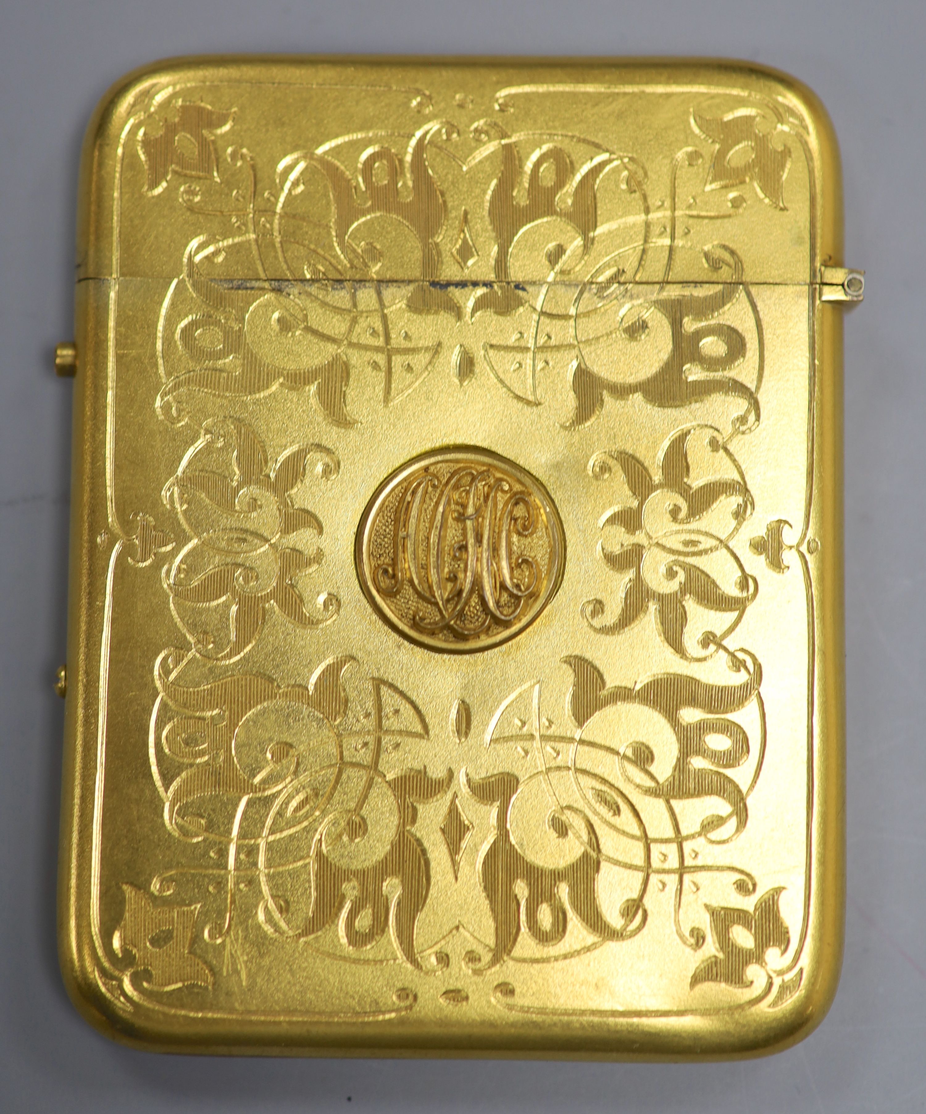 A gilt metal card case, with enamelled armorial badge, 10c,